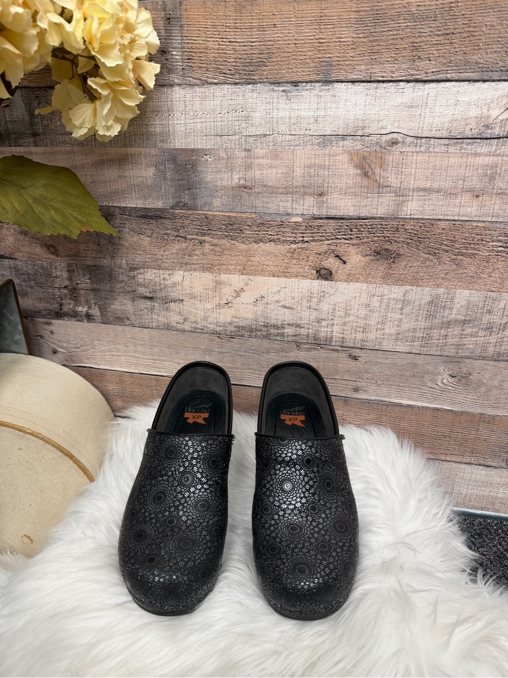 Dansko Black Floral-Perforated Leather Clogs